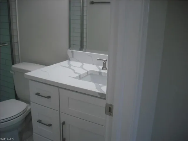 Bathroom featuring toilet and vanity