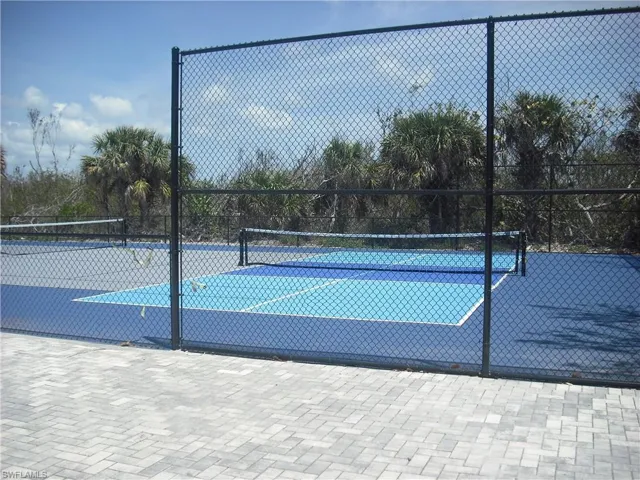 View of tennis court with fence