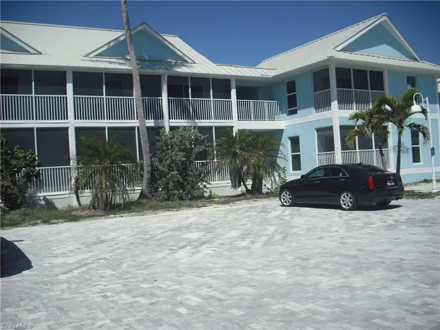View of exterior entry with stucco siding