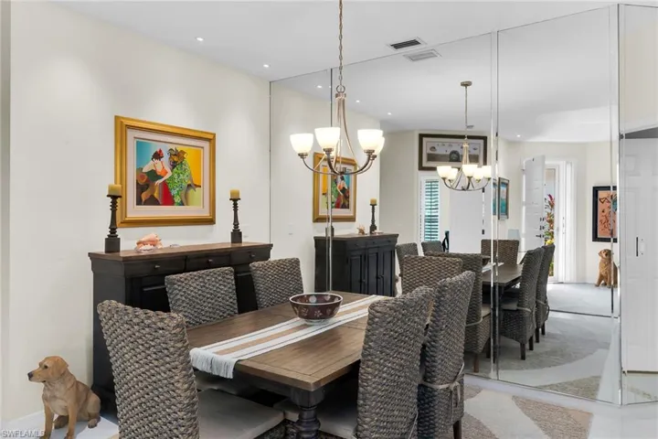 Dining room with a chandelier and baseboards