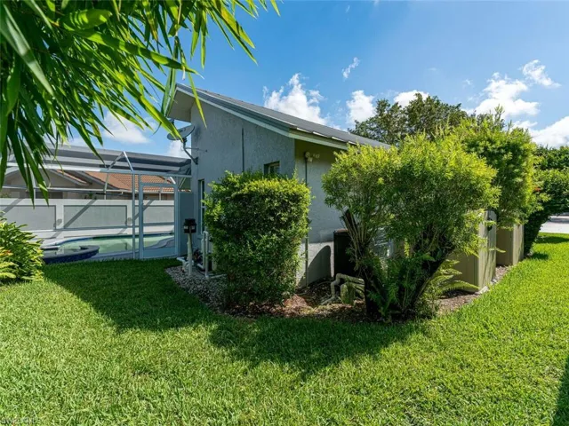 View of yard with a lanai