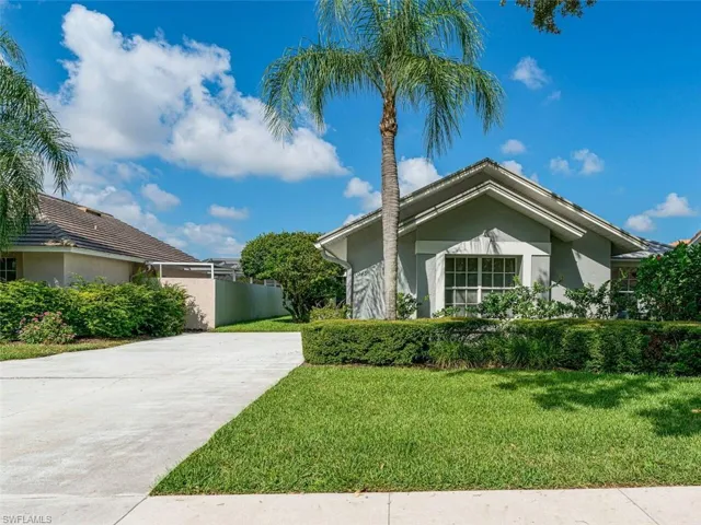 View of front of property with a front lawn