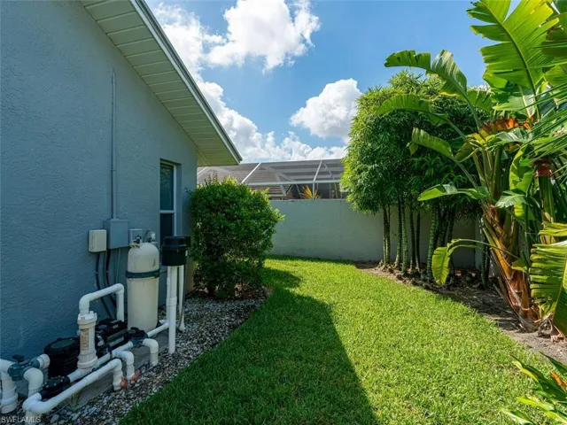 View of yard featuring glass enclosure