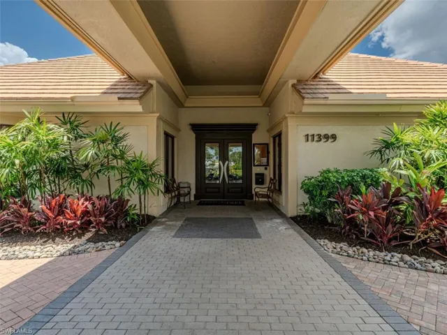 View of exterior entry featuring french doors