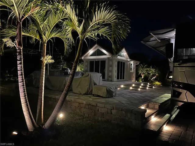 Patio at night featuring a patio