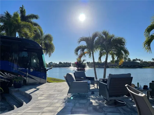 View of patio with a water view
