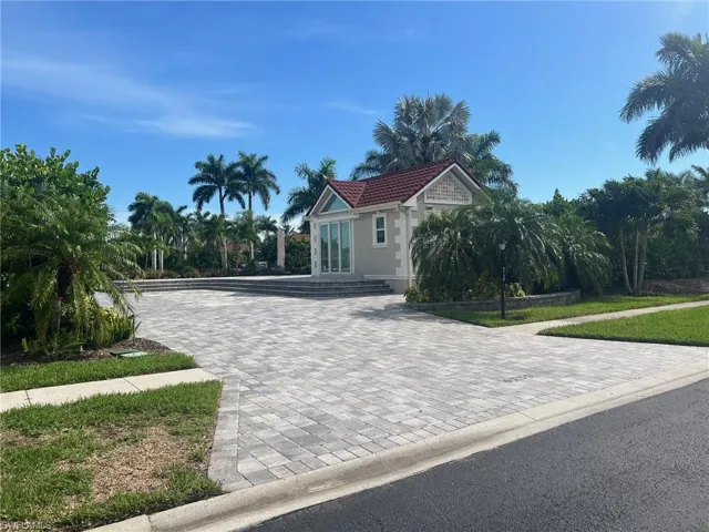 Mediterranean / spanish-style home with decorative driveway