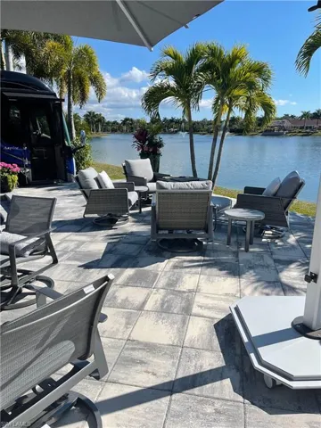 View of patio featuring a water view and an outdoor hangout area