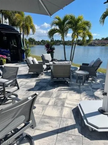 View of patio / terrace featuring a water view and outdoor lounge area
