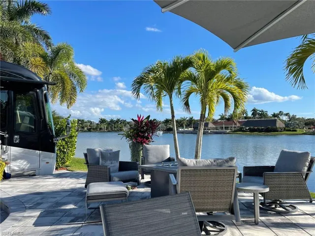 View of patio with a water view