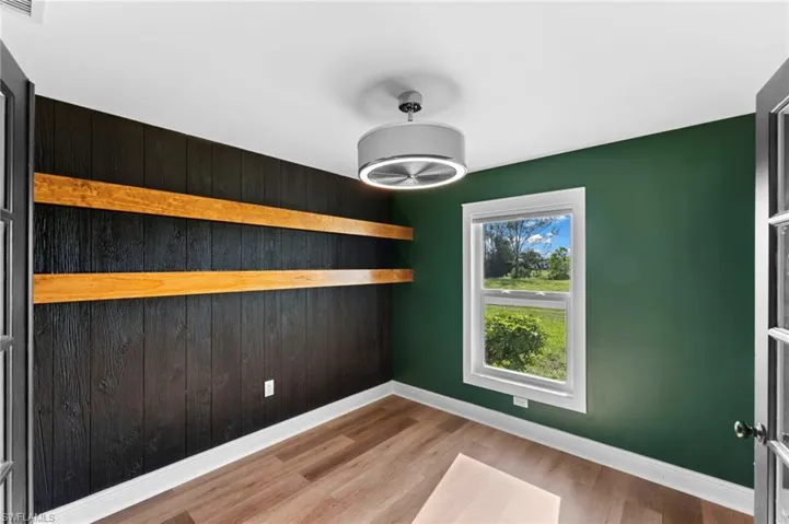 Spare room featuring hardwood / wood-style floors