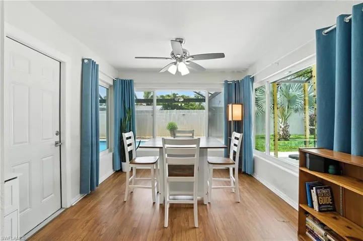 Dining area featuring a ceiling fan and wood finished floors