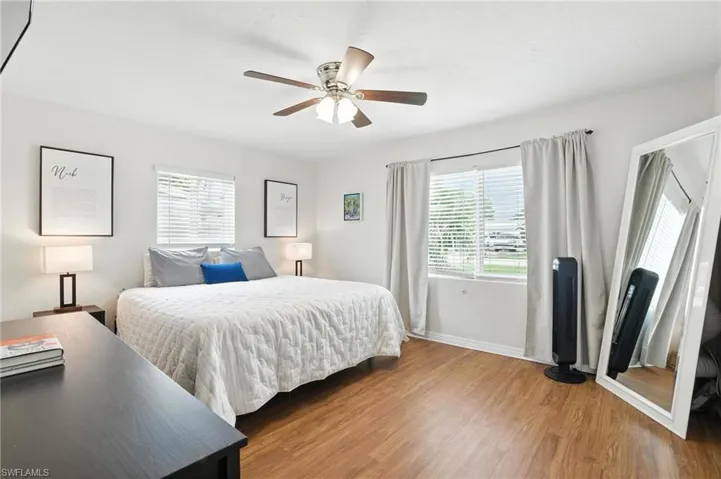 Bedroom with wood finished floors and ceiling fan