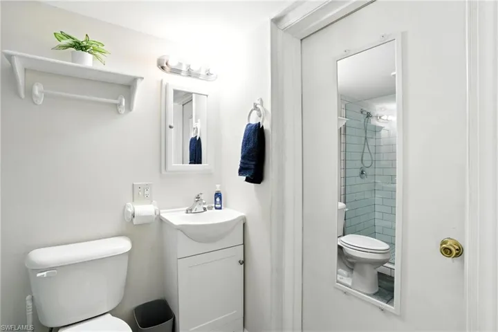 Bathroom featuring vanity and a tile shower