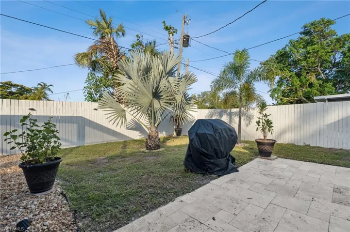 Fenced backyard with a patio area