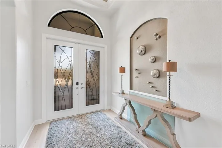Foyer featuring french doors and light wood-type flooring