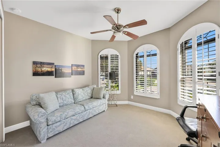 Office space featuring carpet flooring and ceiling fan