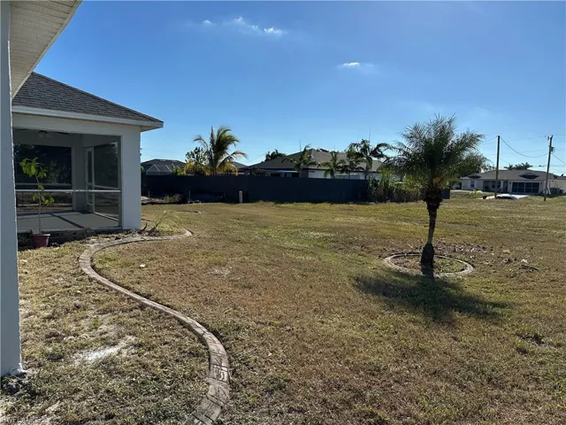 View of yard with a sunroom