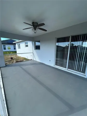View of patio featuring ceiling fan