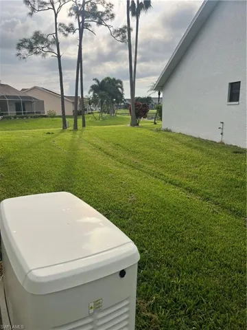 Whole house generator, conveniently located in large side yard.