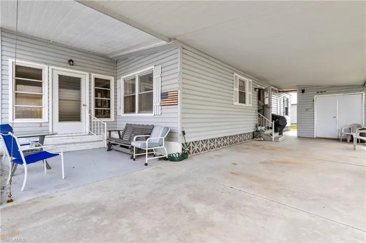 View of patio / terrace featuring entry steps and a carport