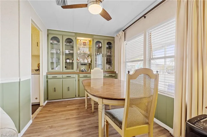 Dining area with light wood-style floors