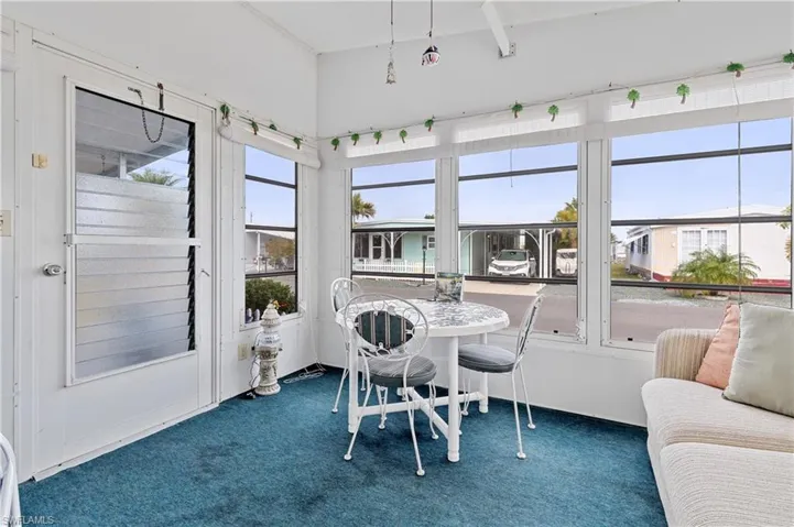 Sunroom with carpet floors