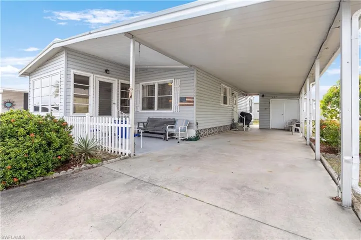 View of patio / terrace featuring a carport