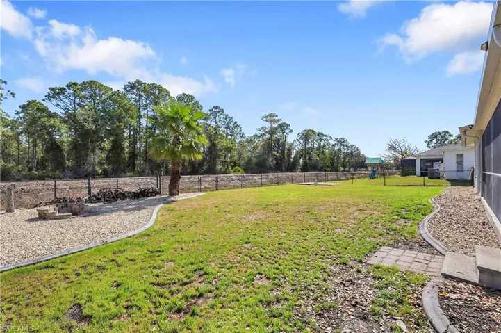 View of large fenced backyard