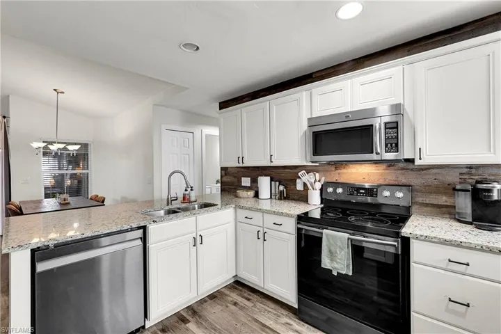 Kitchen with stainless steel appliances, with a 1-year old dishwasher
