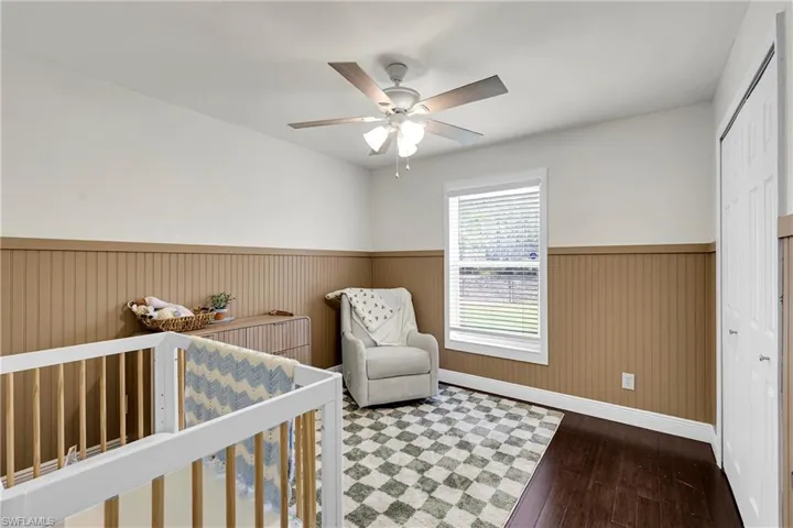 Guest bedroom # 1 featuring newly installed wainscoting, perfect for a nursery room