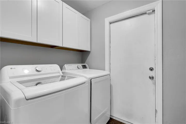 Inside laundry room featuring a 1-year old washer and clothes dryer