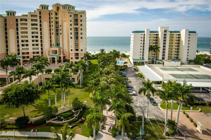 Birds eye view of property with a water view