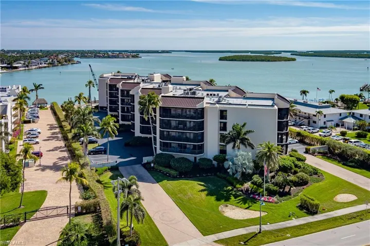 Birds eye view of property with a water view
