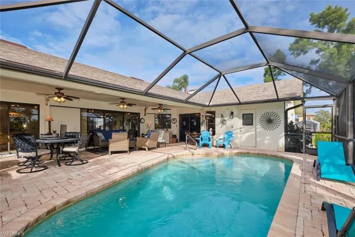 The 32 X 33 foot screened lanai with pool and with 1/2 being covered to provide an extension outdoor living area.
