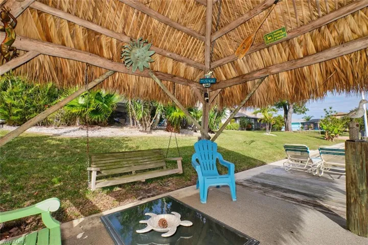Tiki Hut with porch swing.  What a place to relax!
