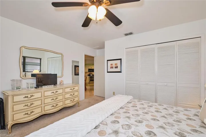 Guest bedroom #1 featuring a large closet and room for a king size bed.