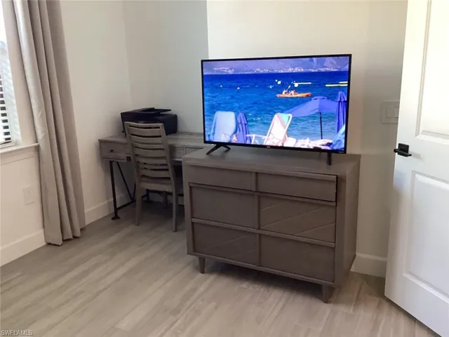 Home office featuring light wood-style flooring