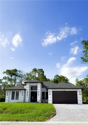 Contemporary exterior with a dark shingle roof and white stucco finish