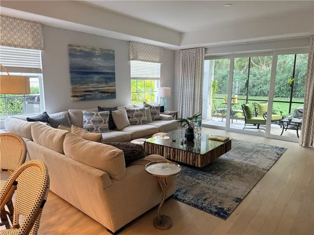 Living room with hardwood / wood-style flooring