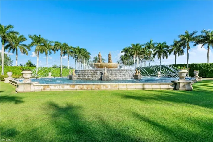 View of pool with a yard and a patio