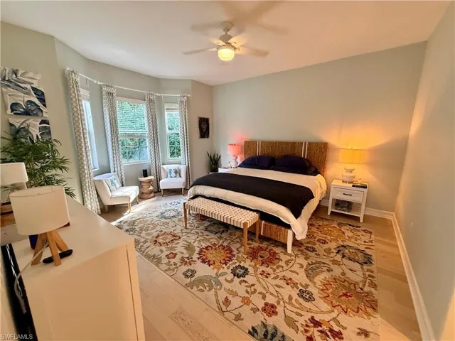 Bedroom featuring light wood-style flooring and ceiling fan