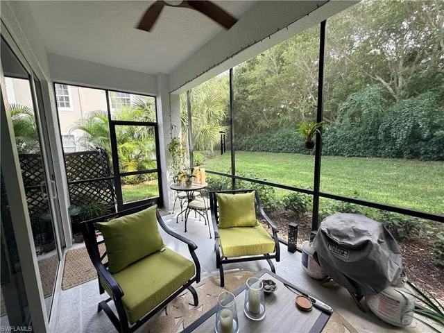 Sunroom featuring a ceiling fan