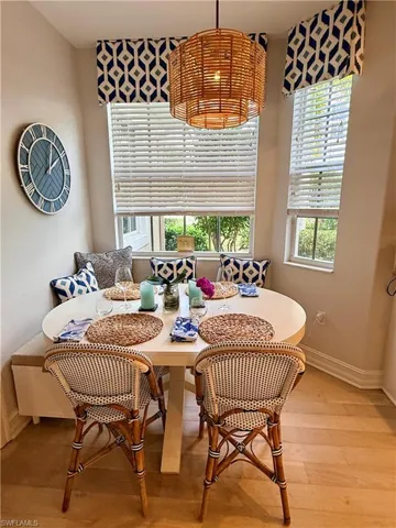 Dining space with healthy amount of natural light, light wood-style flooring, and breakfast area