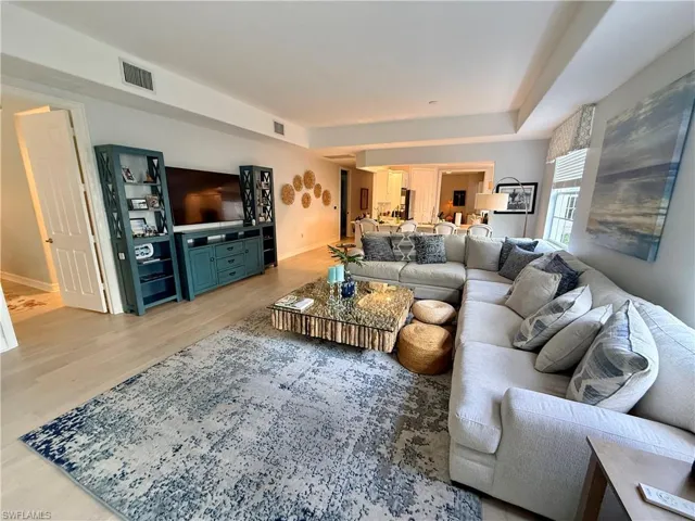 Living room with light wood-type flooring