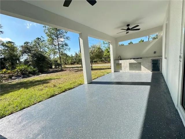 View of patio / terrace with area for grilling and a ceiling fan