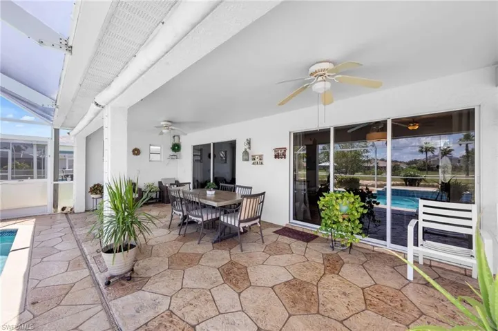 View of patio / terrace featuring ceiling fan, an outdoor pool, and outdoor dining area