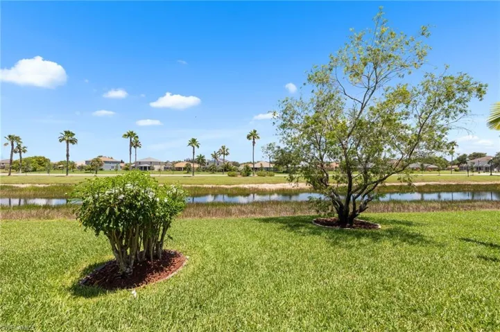 View of green lawn with a water view