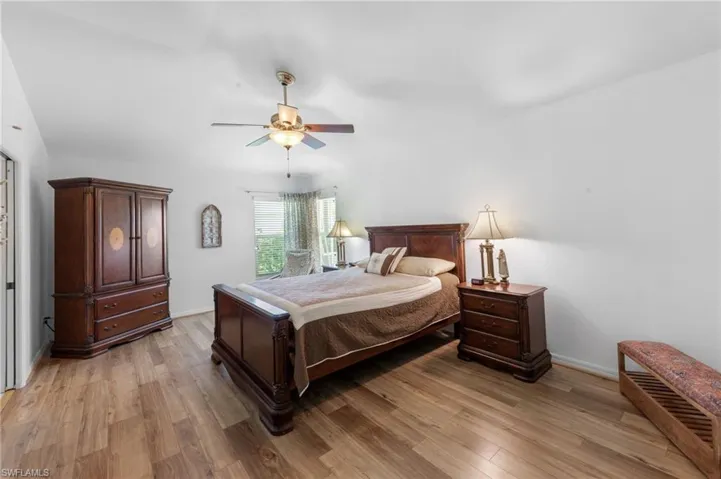 Bedroom featuring light wood-type flooring and a ceiling fan
