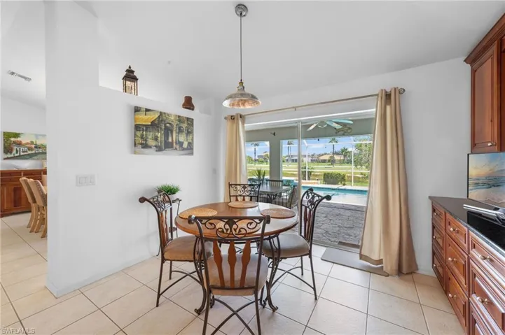 Dining area featuring light tile patterned flooring